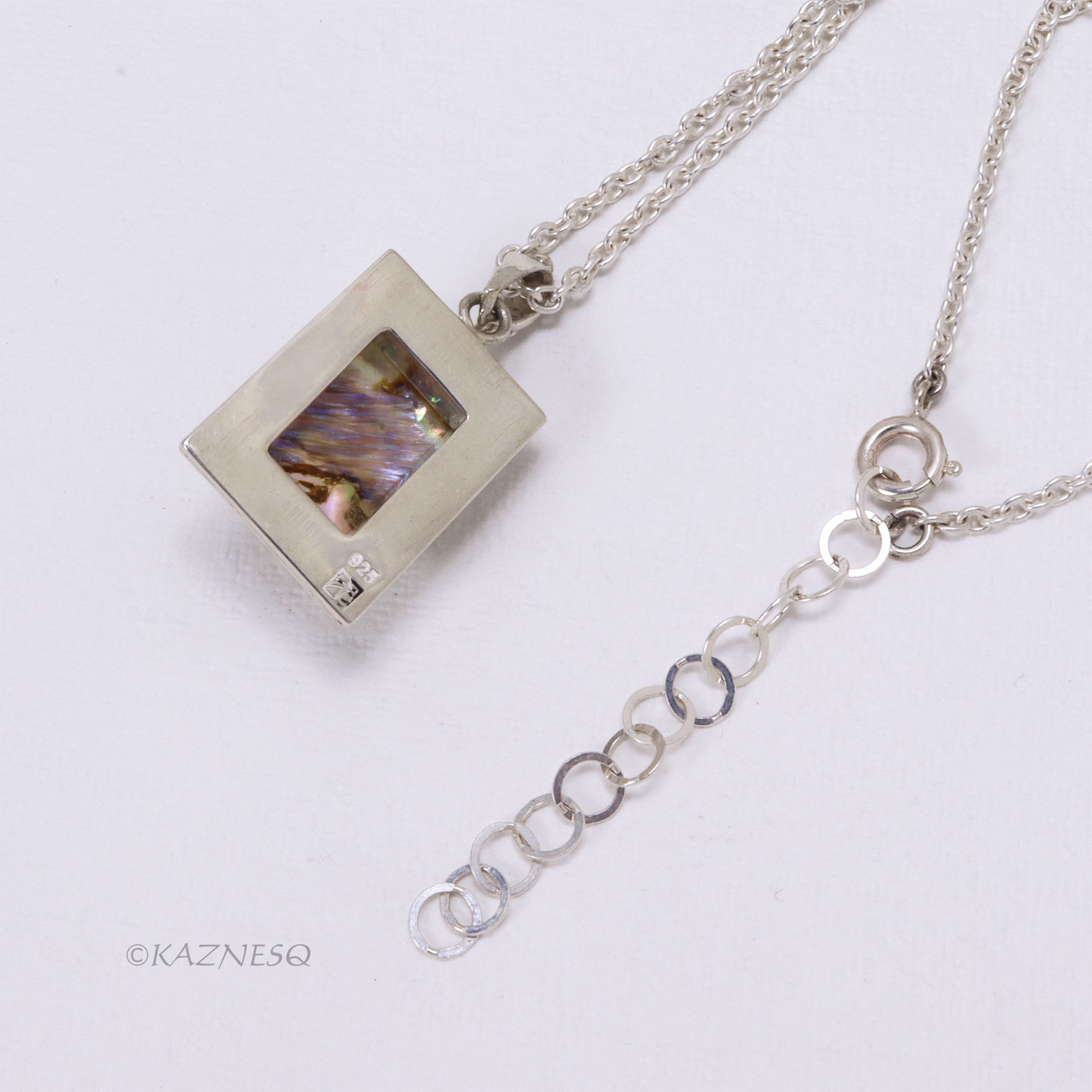 Alluring iridescence! : Rutilated Quartz with Paua Shell Rectangle Silver Pendant