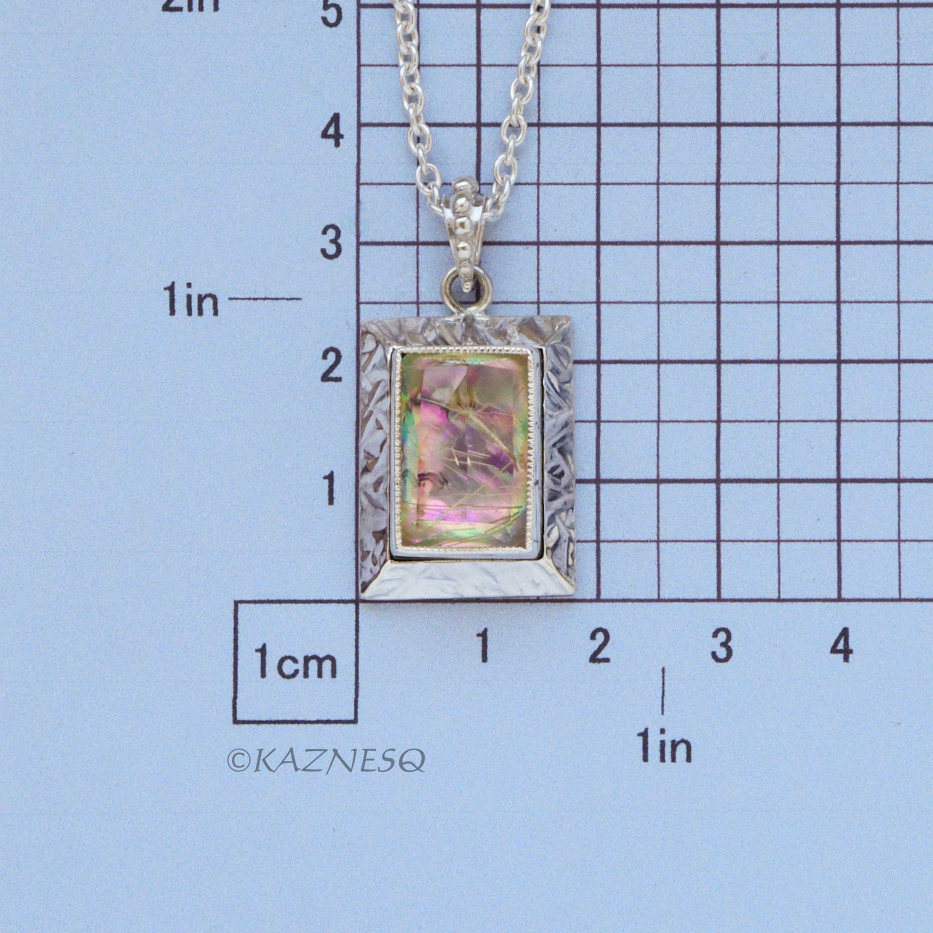 Alluring iridescence! : Rutilated Quartz with Paua Shell Rectangle Silver Pendant