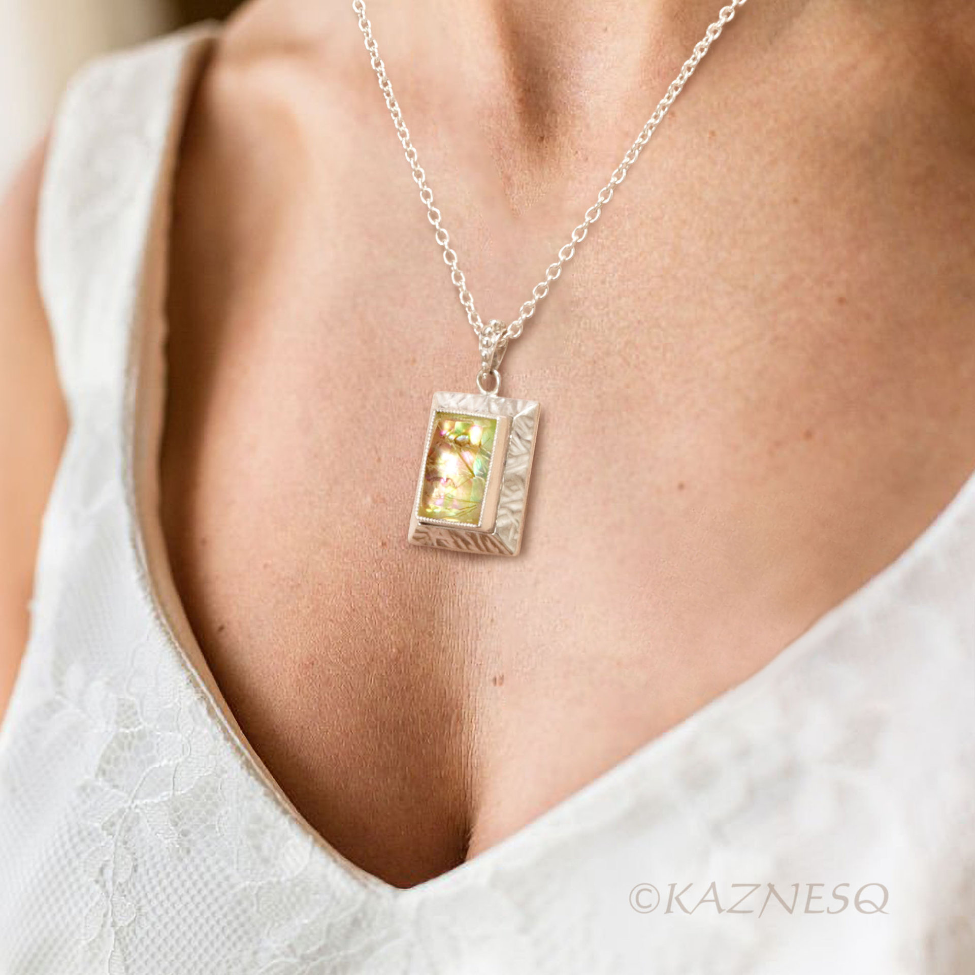 Alluring iridescence! : Rutilated Quartz with Paua Shell Rectangle Silver Pendant