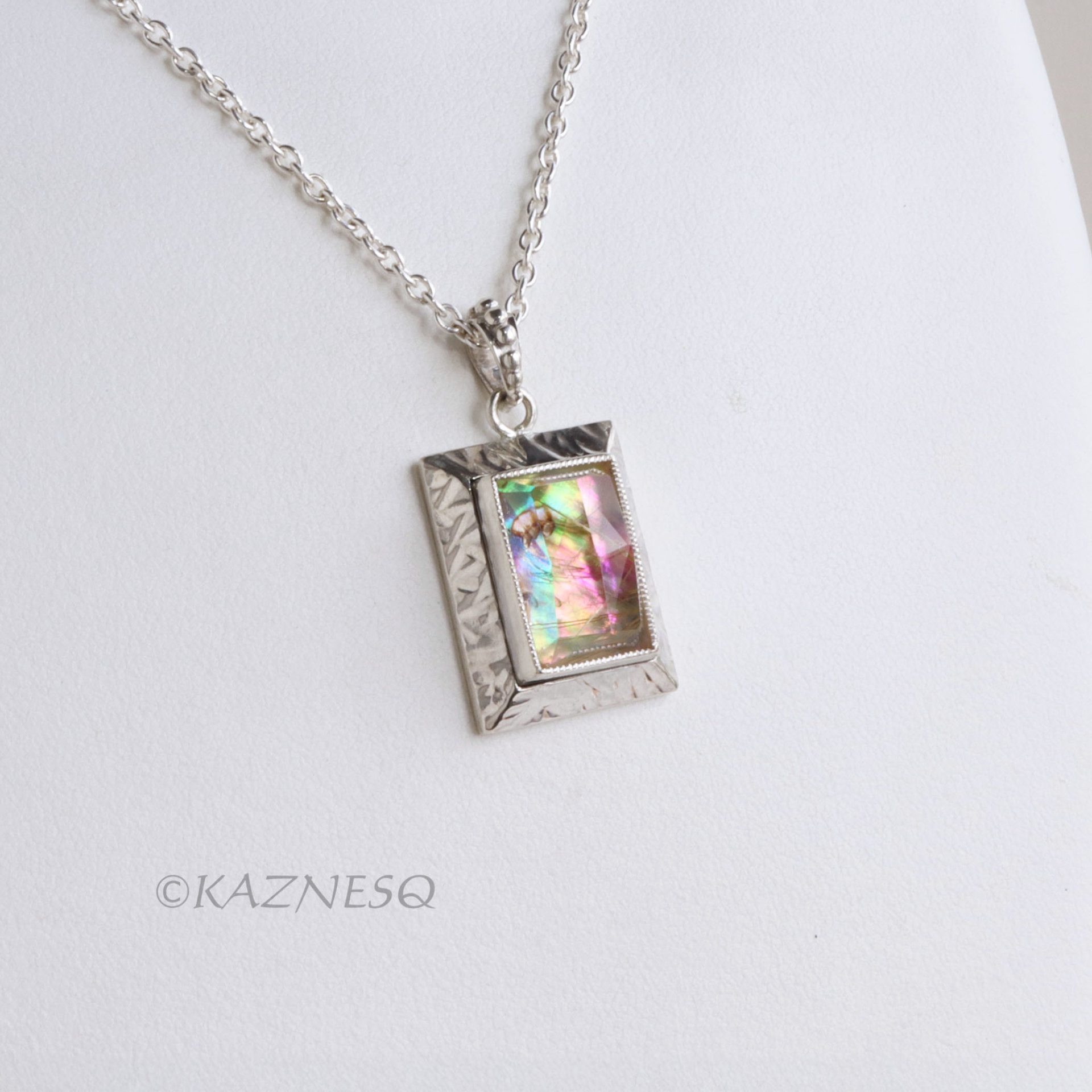 Alluring iridescence! : Rutilated Quartz with Paua Shell Rectangle Silver Pendant