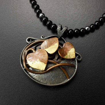 Copper leaf oval pendant