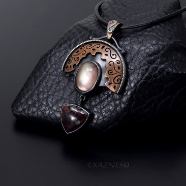 Quartz lined with Black Mother of Pearl Openwork Copper and oxidized silver Arch pendant featuring Eudialyte