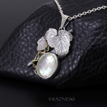 Mystical Brilliance! Silver Leaf Pendant with Rutilated Quartz Backed by Mother of Pearl